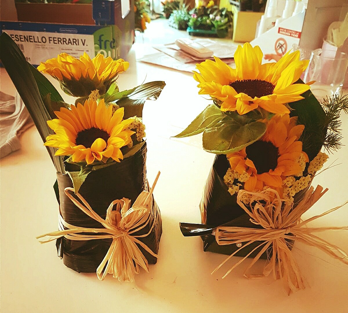 Centrotavola Girasoli con Foglie di Aspidistria Fioreria Bruseghini Besenello Trento